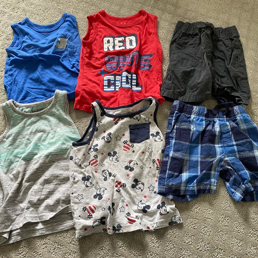 4 boys tank tops and 2 pairs of shorts